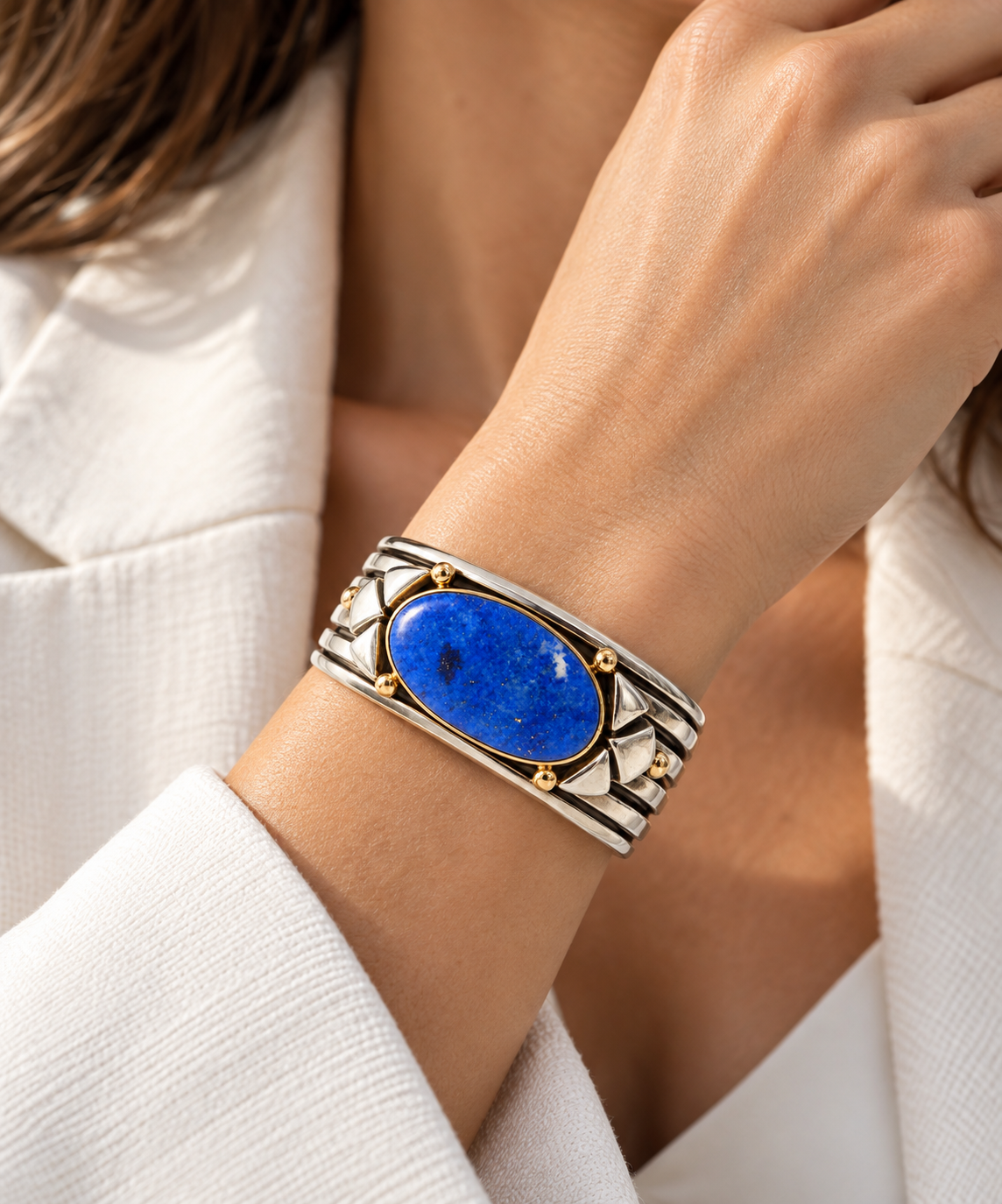 Sterling silver cuff bracelet with lapis lazuli Cabochon on by Marita Gil.