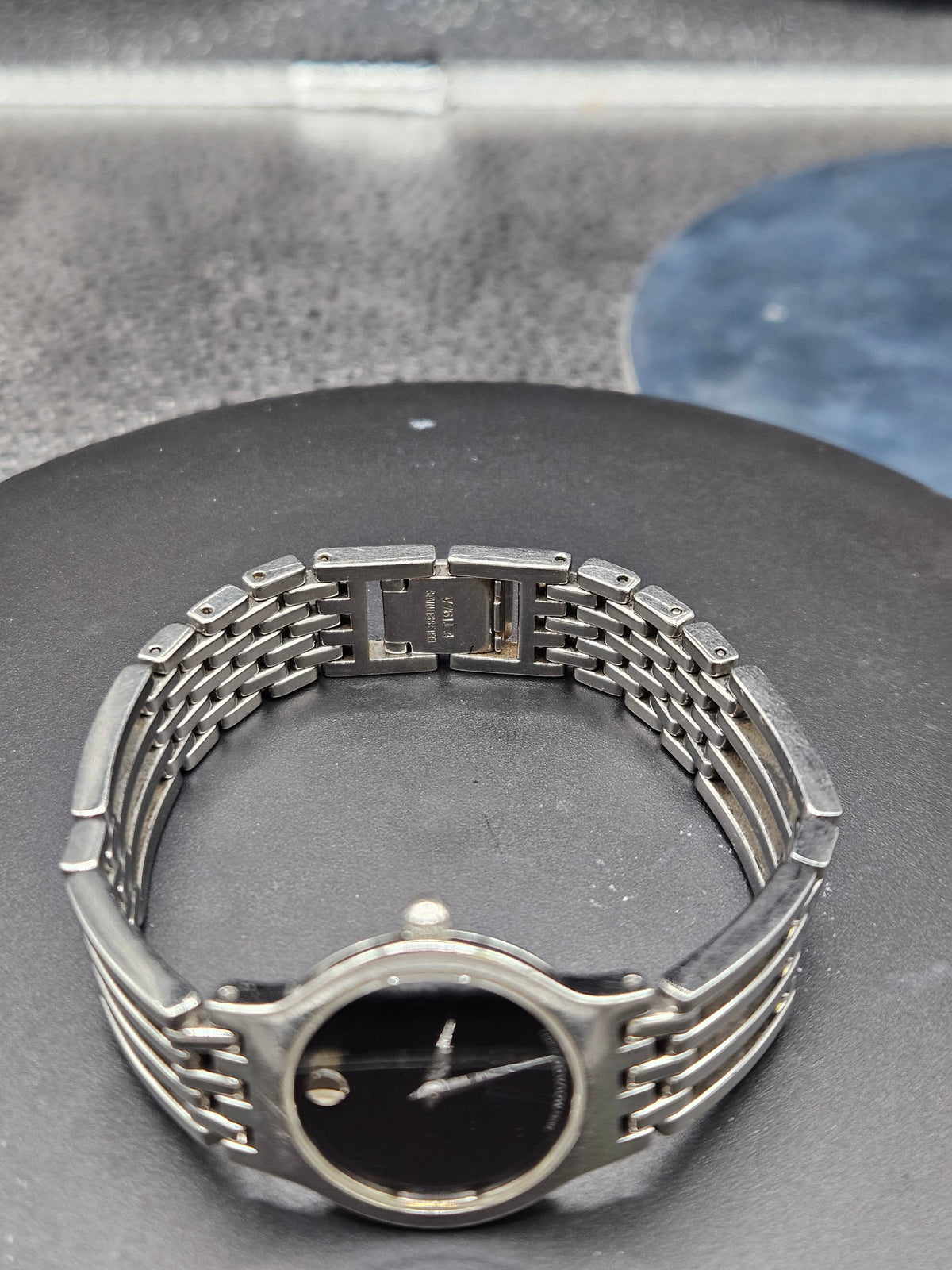 Vintage Movado Esperanza with crystal and black dial face, stainless steel bracelet