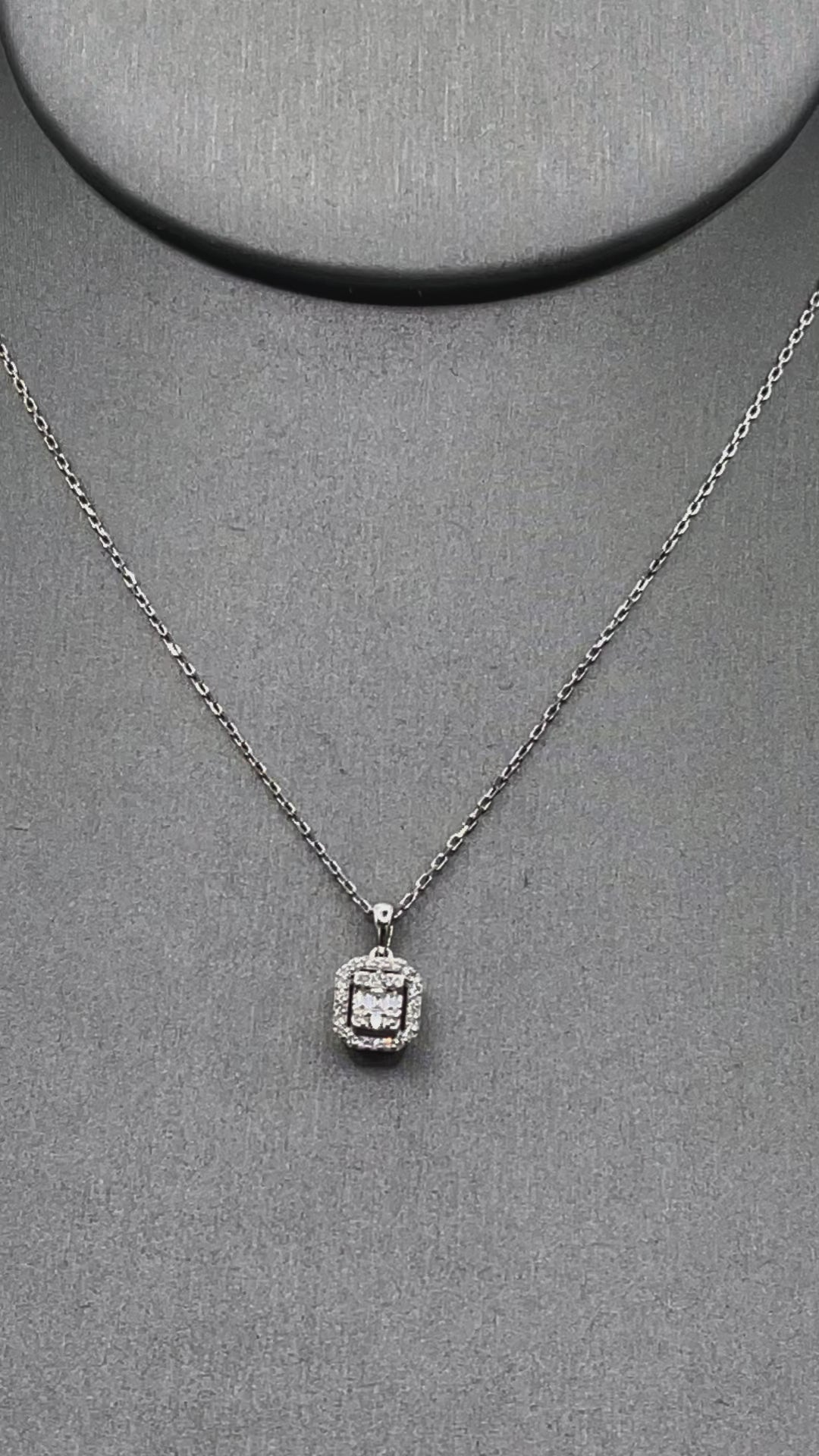 Movie of Ladies 18 Karat White Gold Emerald & Round Diamond Halo Pendant & Chain