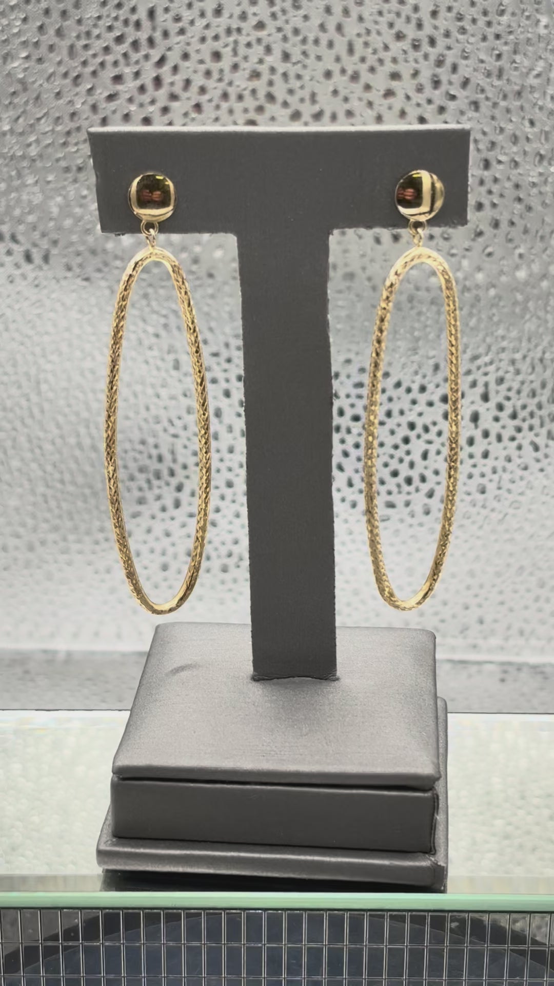 Movie of Ladies 14 Karat Yellow Gold Large Oval Dangling Hoop Earrings