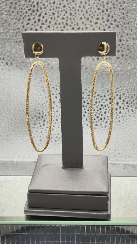 Movie of Ladies 14 Karat Yellow Gold Large Oval Dangling Hoop Earrings
