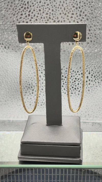 Movie of Ladies 14 Karat Yellow Gold Large Oval Dangling Hoop Earrings