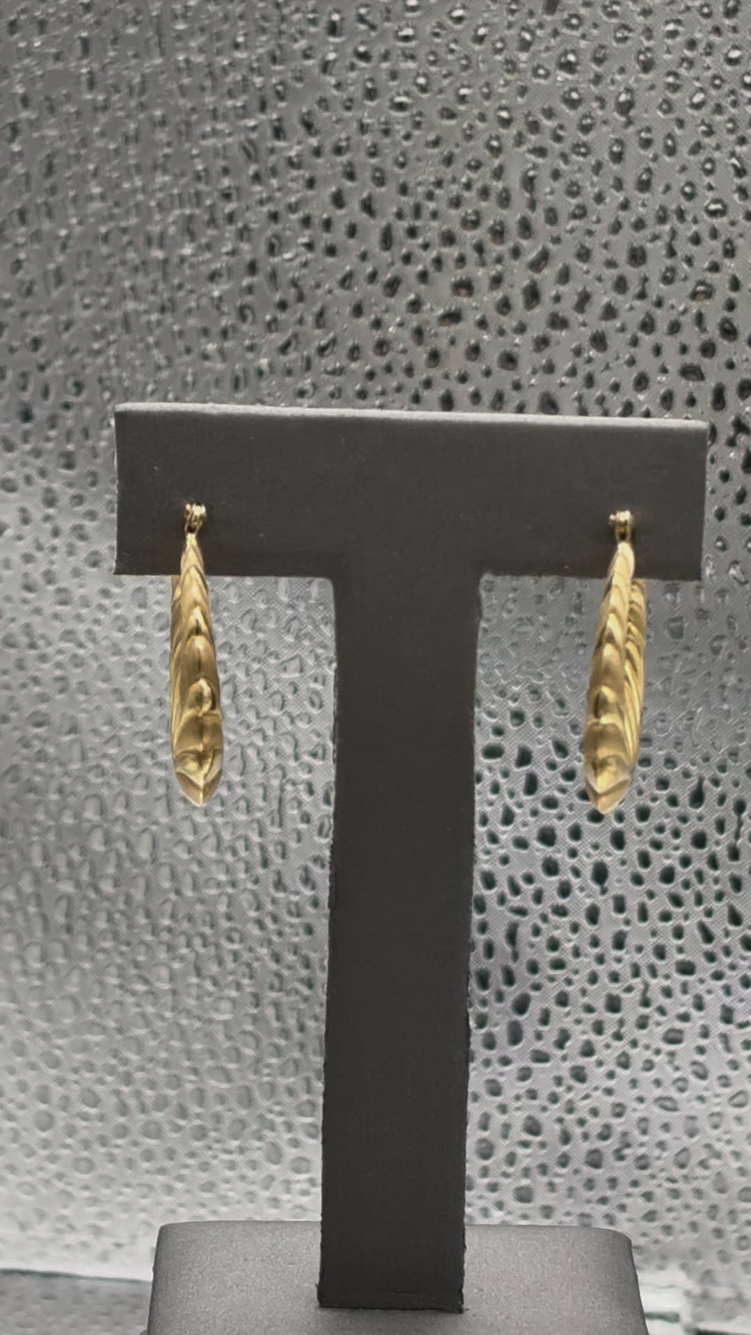 Movie of Ladies 14 Karat Yellow Gold Fluted Floral Hoop Earrings