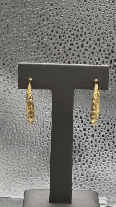 Movie of Ladies 14 Karat Yellow Gold Fluted Floral Hoop Earrings
