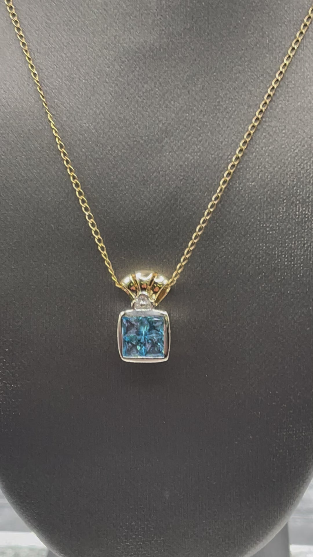 Ladies 14 Karat Solid Two-Toned Gold Blue Topaz and Diamond Pendant