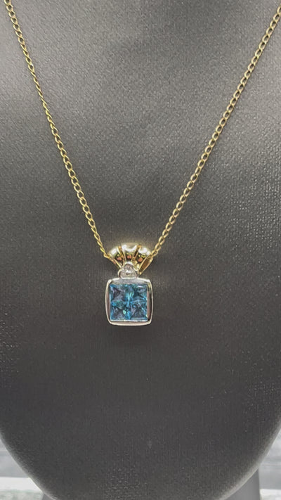 Ladies 14 Karat Solid Two-Toned Gold Blue Topaz and Diamond Pendant