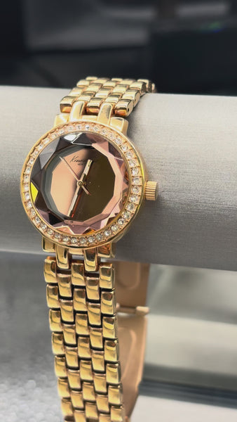 Vintage Kenneth Cole New York women's watch, rose gold-tone quartz model featuring a faceted mirror dial and crystal-accented bezel