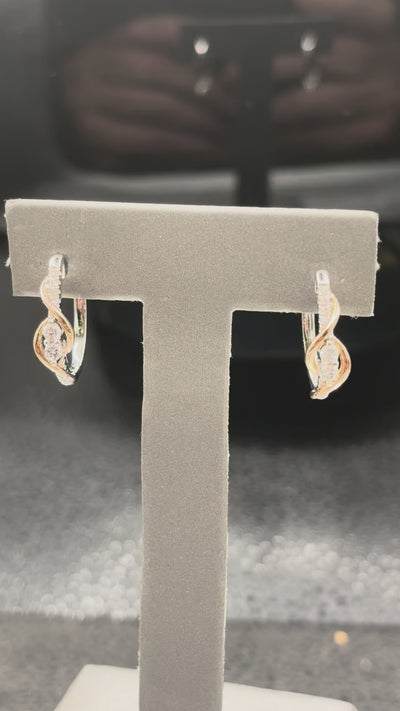 14kt yellow gold diamond and pearl swirl stud earrings