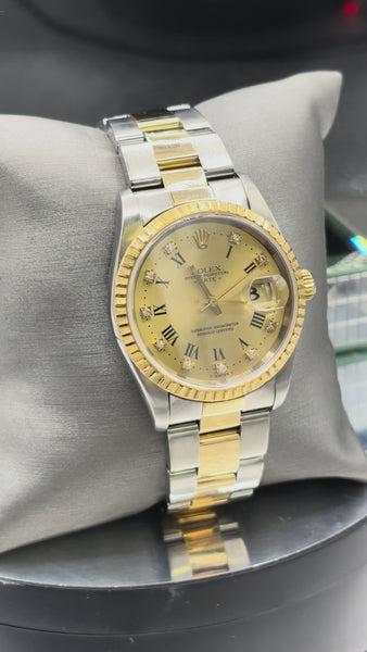 Rolex Oyster Perpetual Date 34mm, 18 karat solid yellow gold and stainless steel men’s watch
