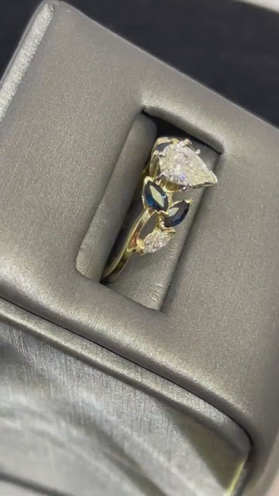 18KT Yellow Gold Custom Designed Pear Shaped Diamond And Marquise Sapphire Engagement Ring