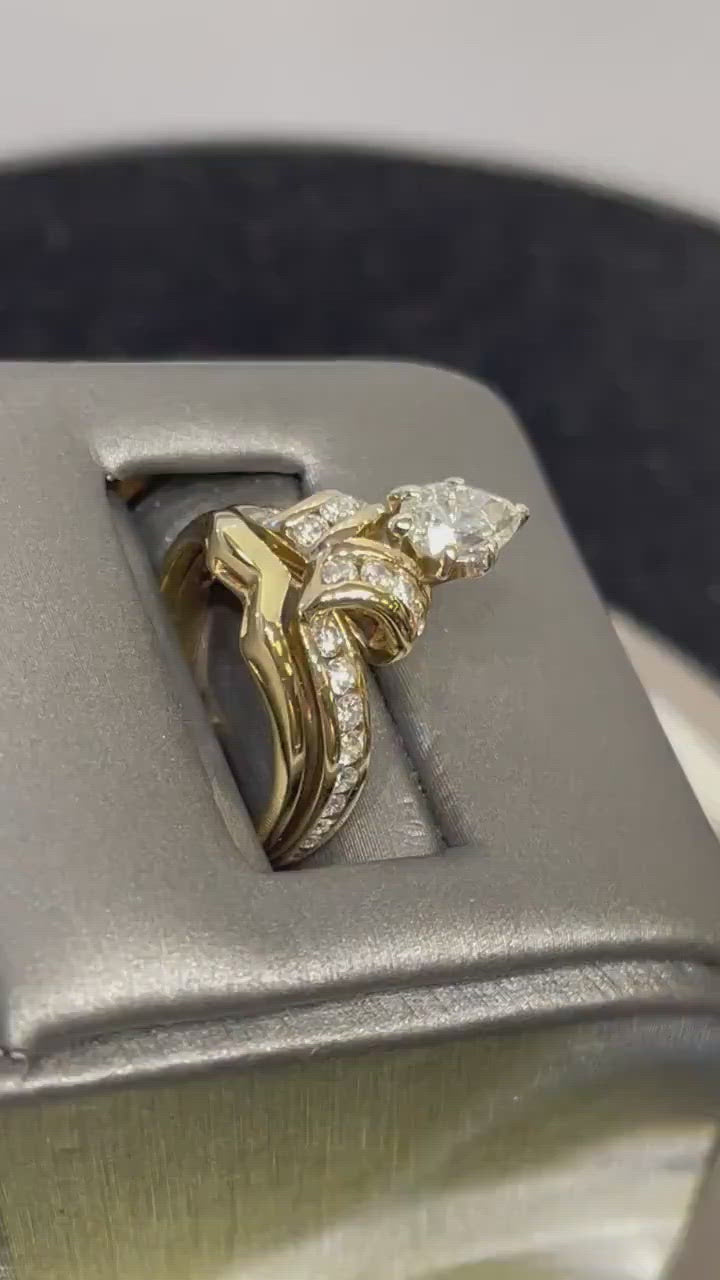 Movie of 14 Karat Yellow Gold Pear Shaped Diamond Engagement Ring