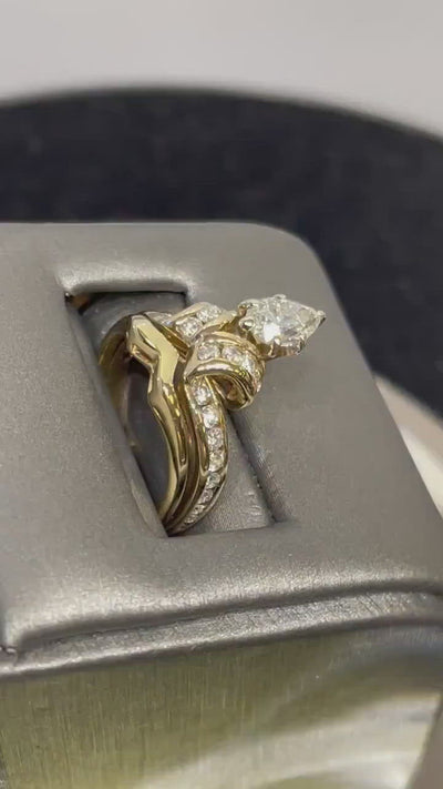 Movie of 14 Karat Yellow Gold Pear Shaped Diamond Engagement Ring