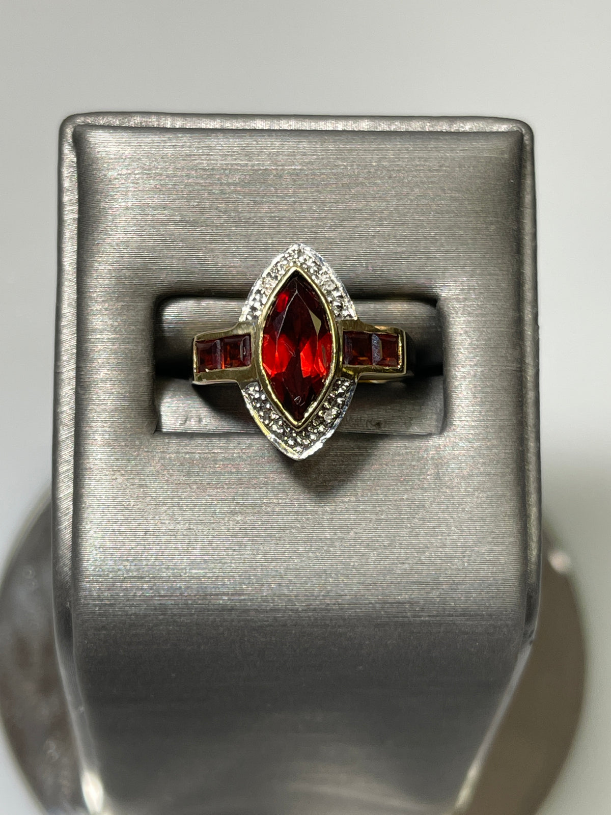 View one of 10 Karat Yellow Gold Garnet And Diamond Accent Ring