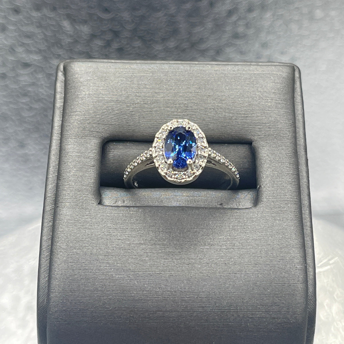 An Exceptional Ladies 14 Karat Gold Sapphire & Diamond Halo Ring
