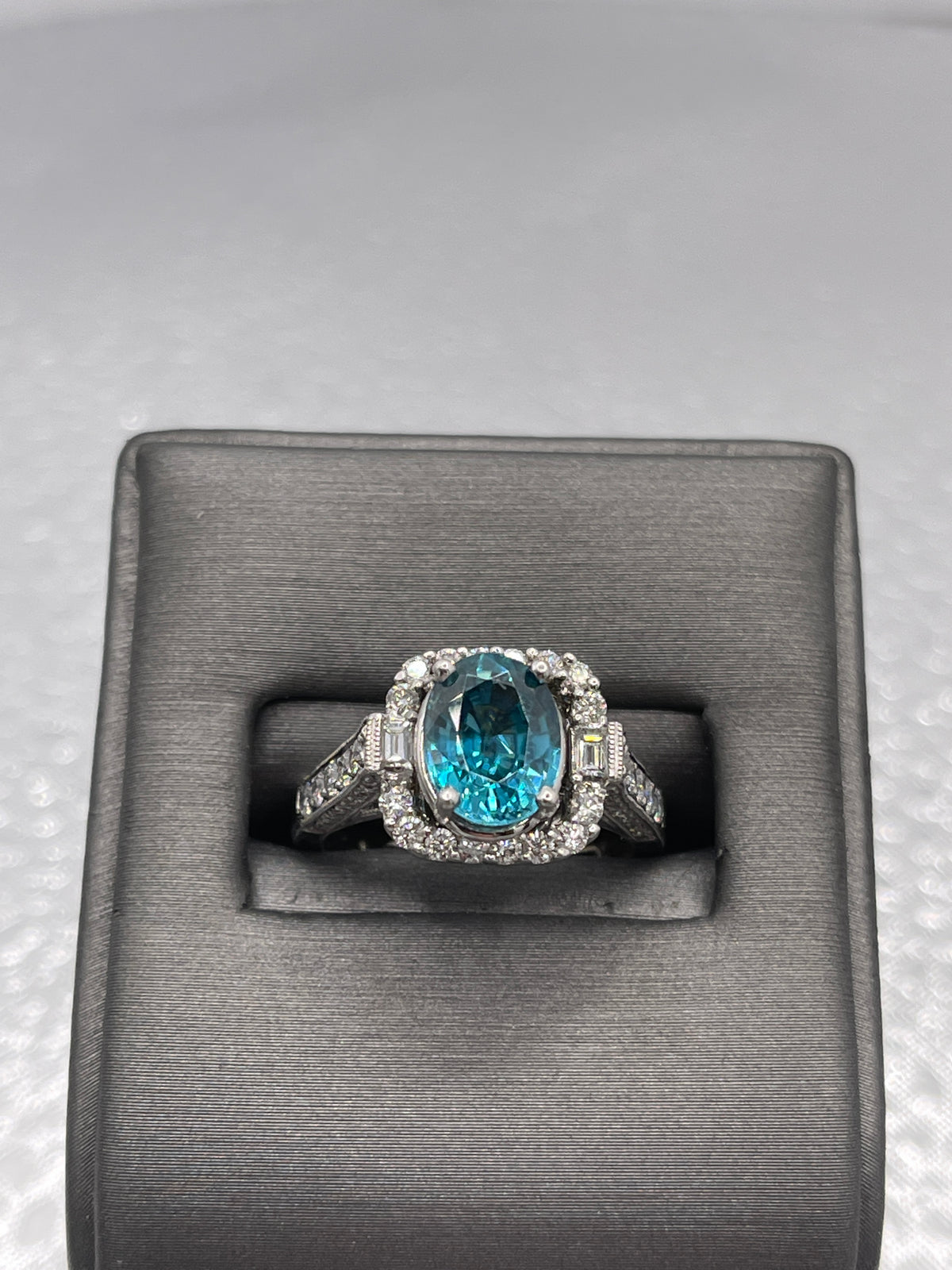 14 Karat White Gold 2 Carat Oval Blue Topaz With Baguettes & Round Diamonds Ring