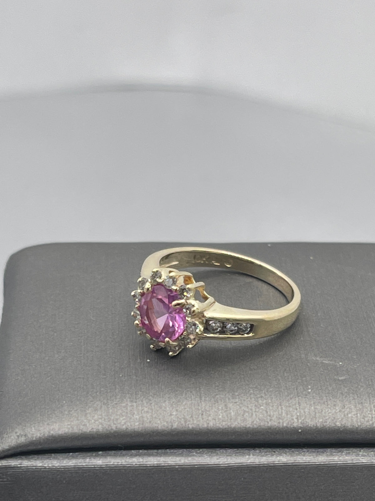A Ladies 10 Karat Yellow Gold Pink Topaz & Diamond Halo Ring