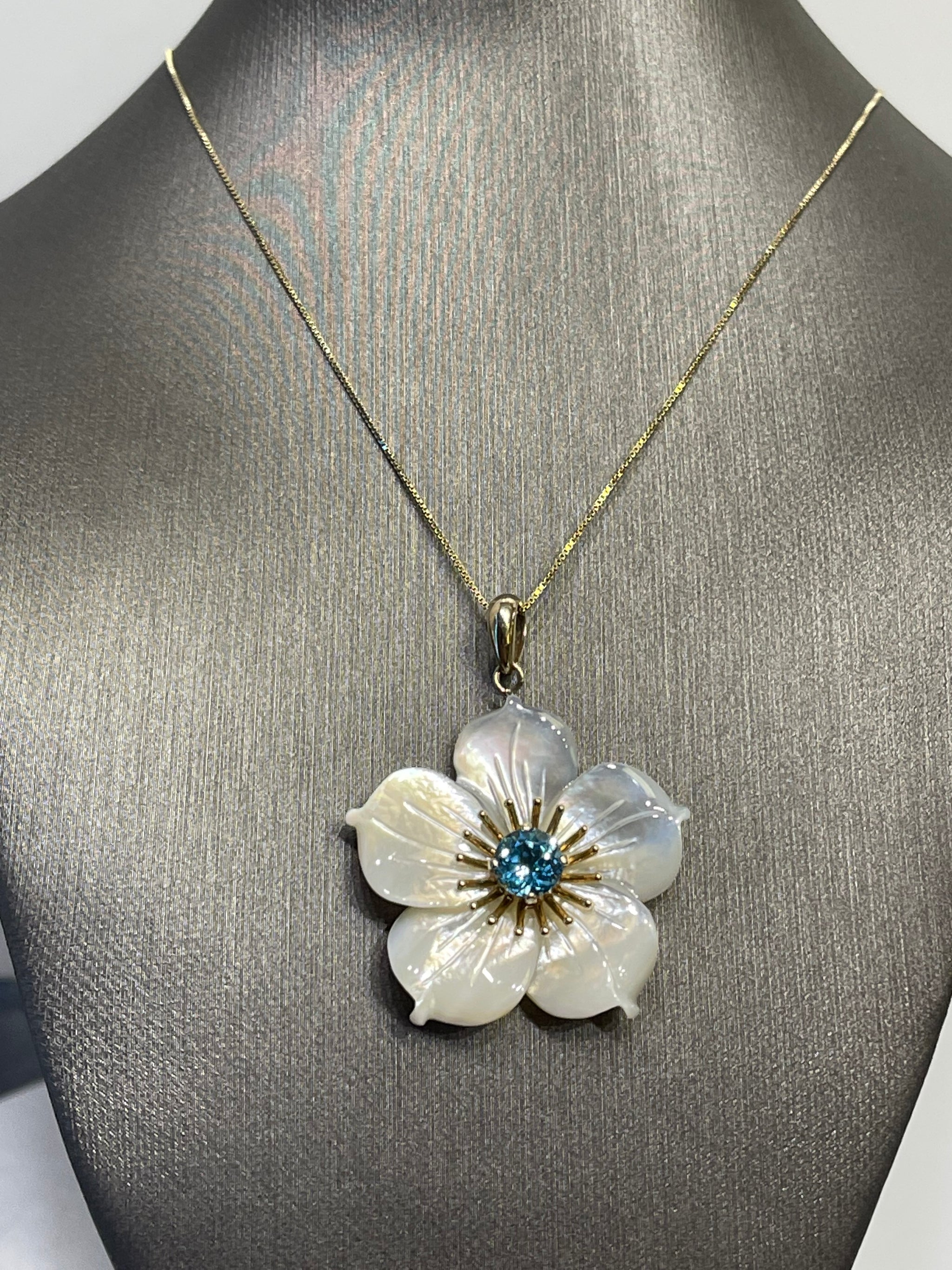 10 Karat Yellow Gold Blooming Mother of Pearl Flower With Blue Topaz N Philadelphia Gold Silver Exchange