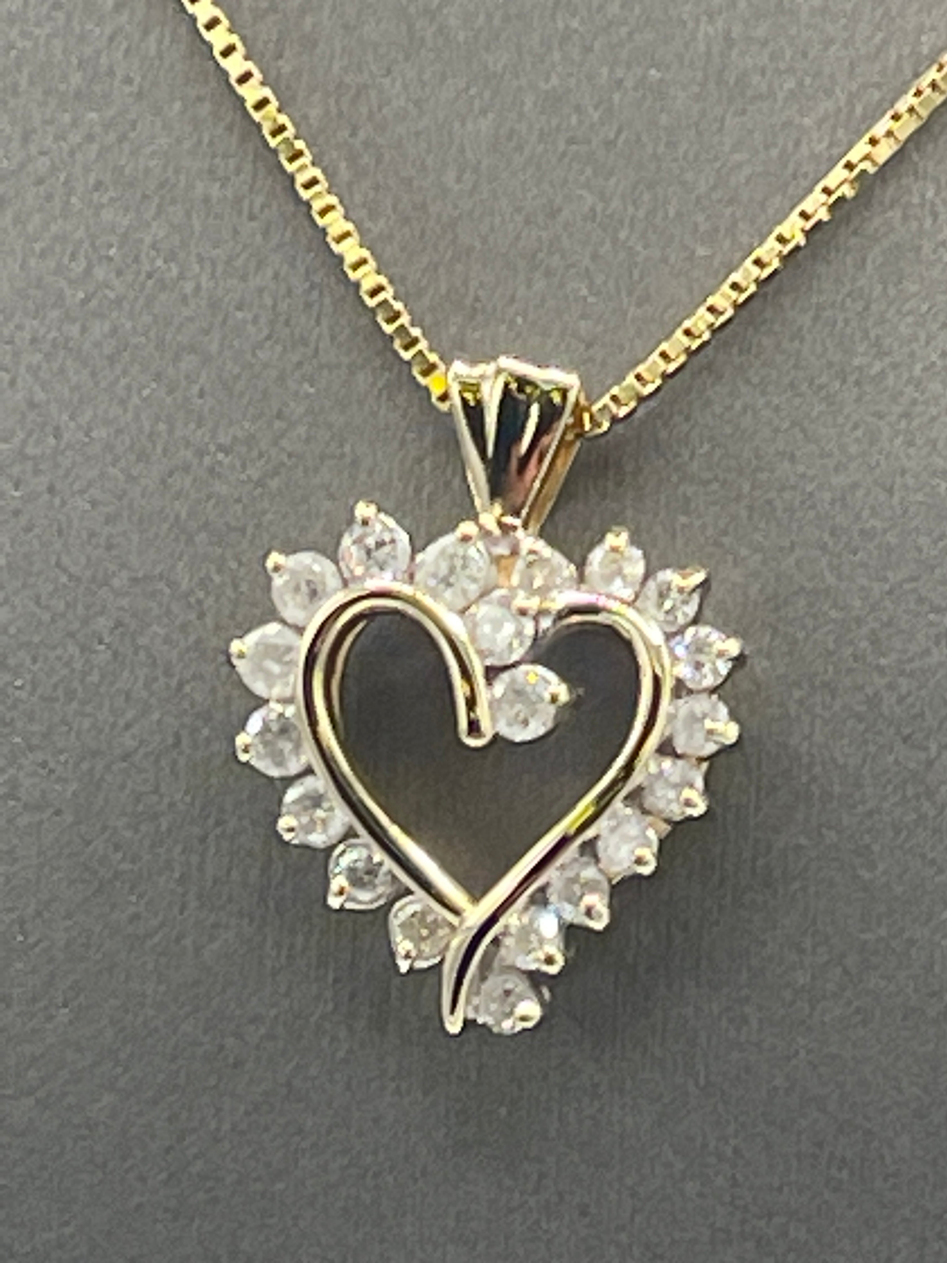 A Ladies Gorgeous 14 Karat Yellow Gold Diamond Heart pendant