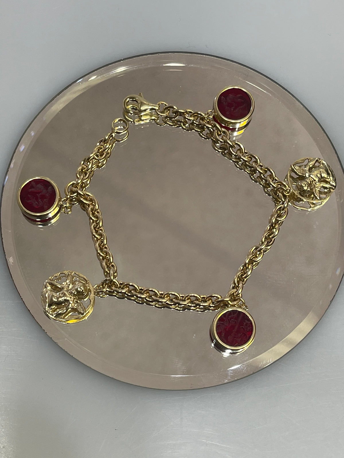 14 karat Yellow Gold Rolo Link Bracelet With Angel Charms & Engraved Red Stone