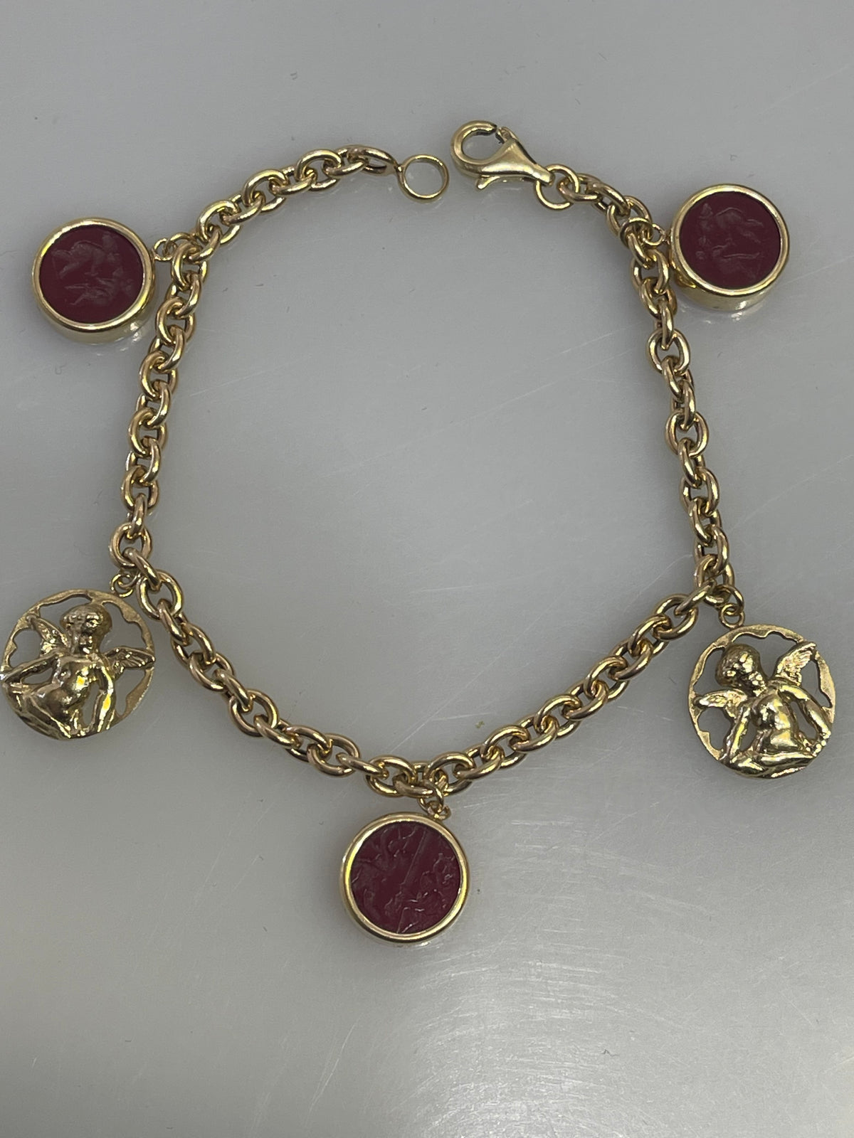 14 karat Yellow Gold Rolo Link Bracelet With Angel Charms & Engraved Red Stone