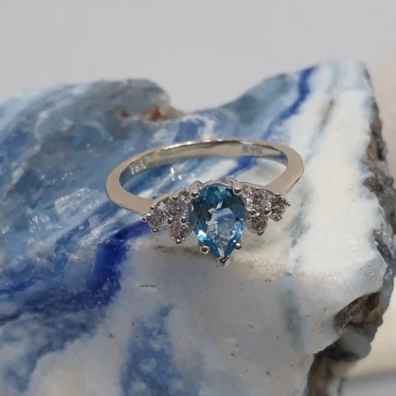 pear shaped blue tanzanite with diamond accents white gold
